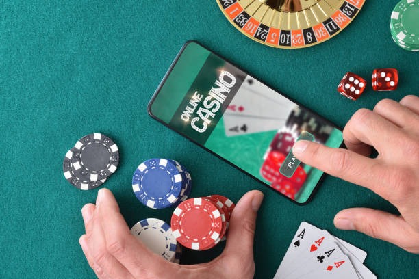 Mobile phone displaying a live dealer blackjack table with player cards and betting interface